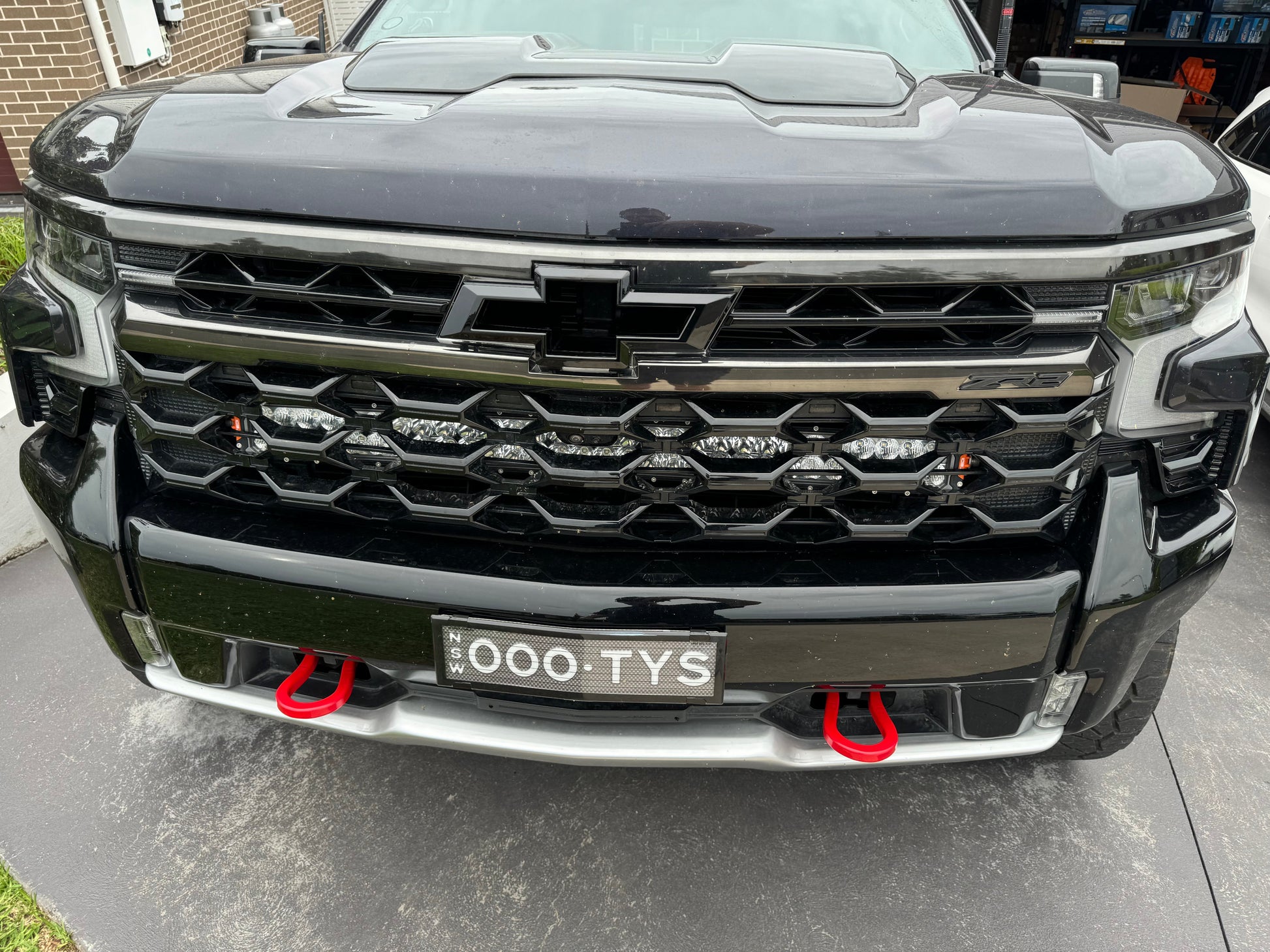 Black bowtie badge for the front grill of a Chevrolet Silverado 1500 ZR2.