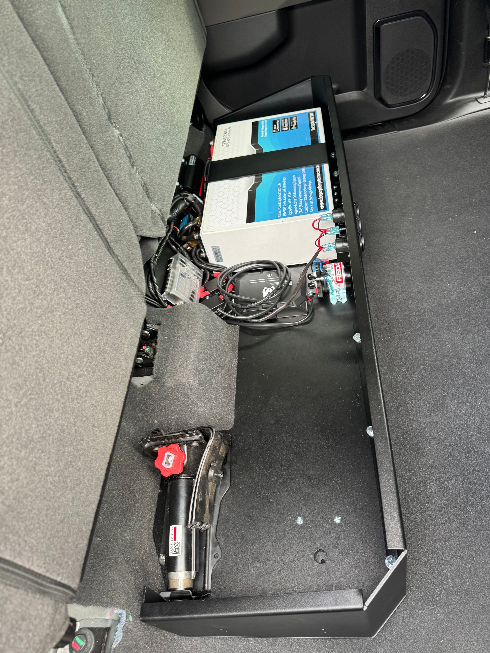 Complete Vehicle Designs under seat storage unit in Chevrolet Silverado 2019+ with DCS Lithium Battery & RedArc BCDC1250D