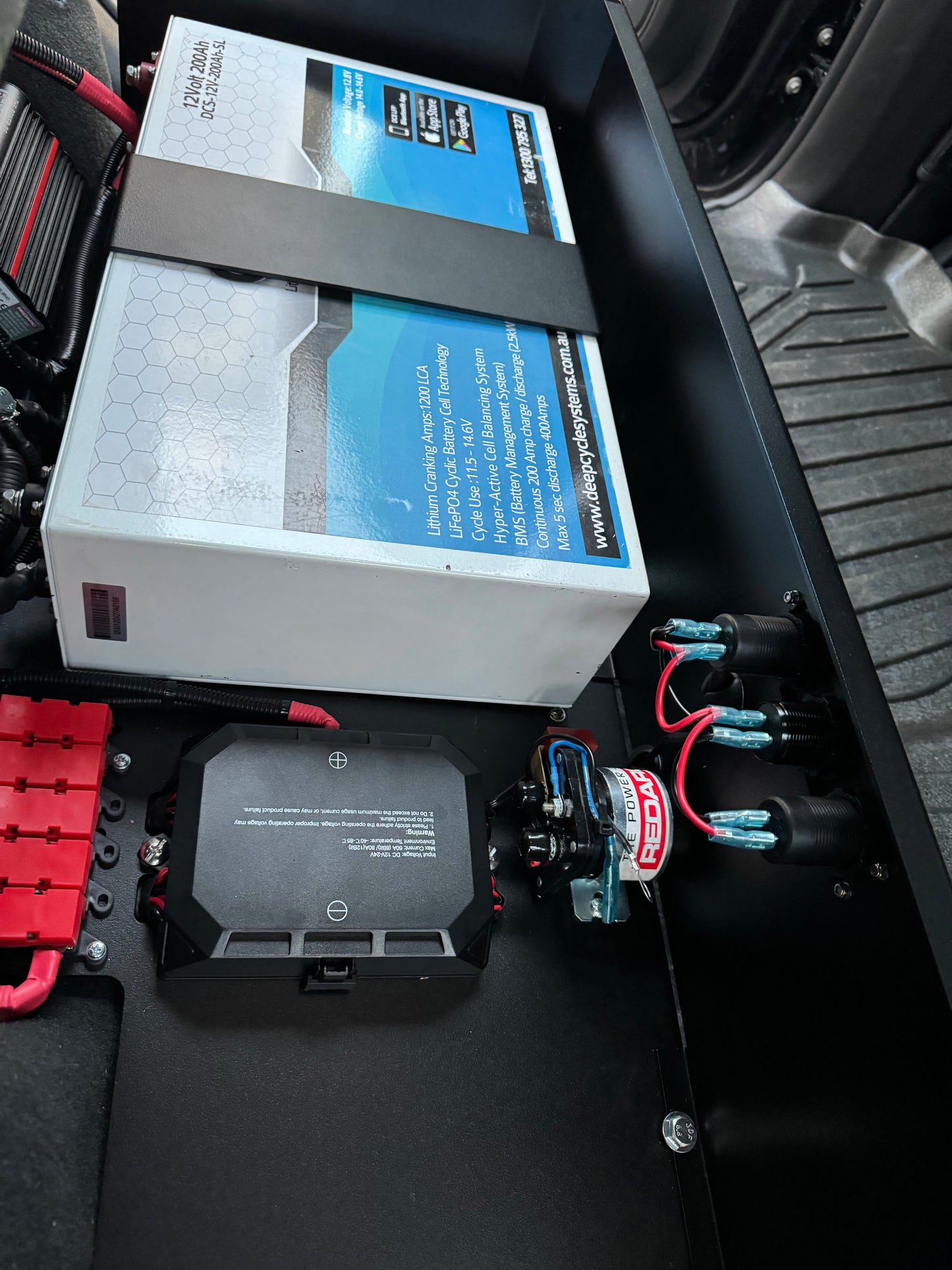 Complete Vehicle Designs under seat storage unit in Chevrolet Silverado 2019+ with DCS Lithium Battery & RedArc BCDC1250D
