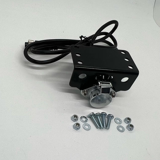 A black steel Wozza Plug Holder Bracket with mounting bolts and a cable, against a white background.