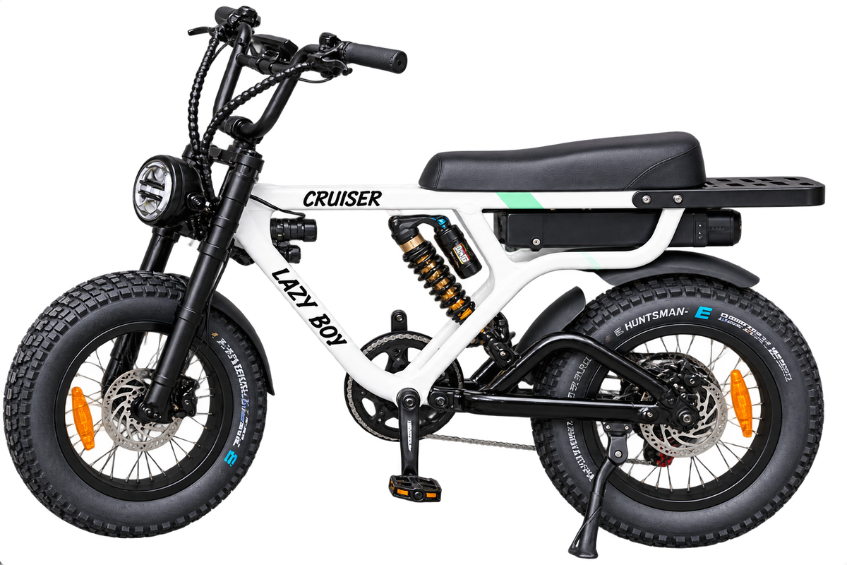 A white and black electric bicycle with fat tires, a black seat, and a rear storage platform, shown on a plain white background. The frame features the brand name 'Lazy Boy' and model 'Cruiser'.