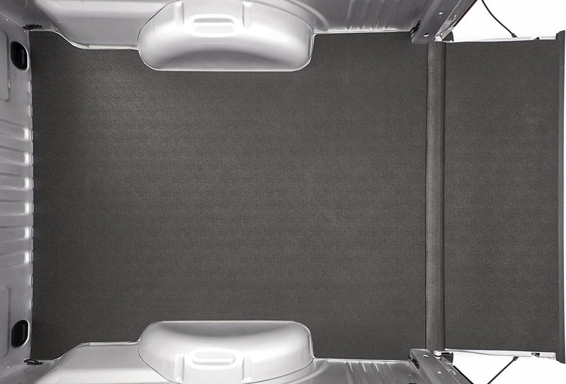 Car trunk with a gray cargo cover and a white car mat Bedrug Liner