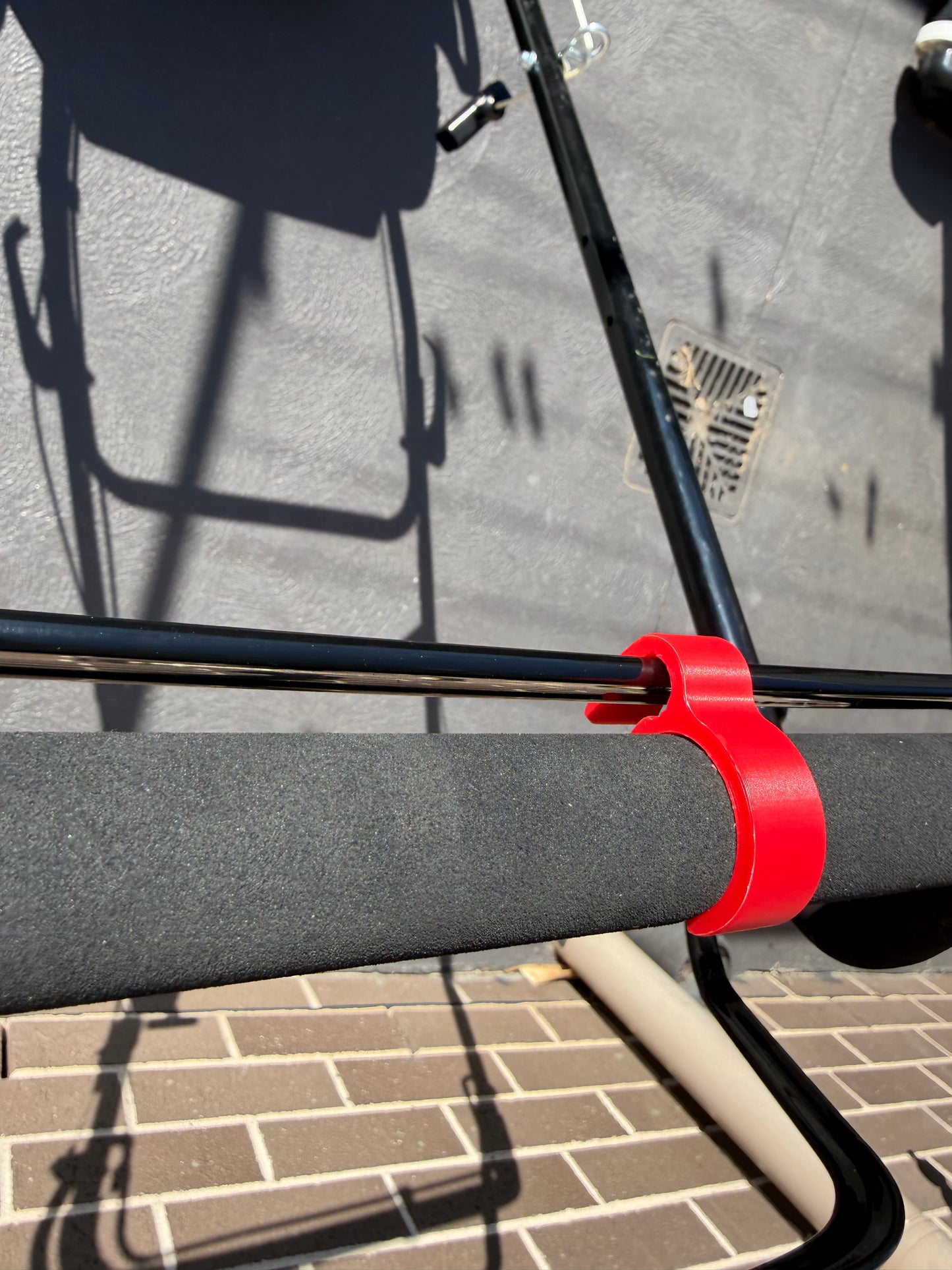 A Masport Walk Behind Lawn Mower with a 3D Printed Clip-on Brake Lever Holder